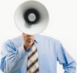 Man holding a megaphone by Pressmaster via Pexels.com.